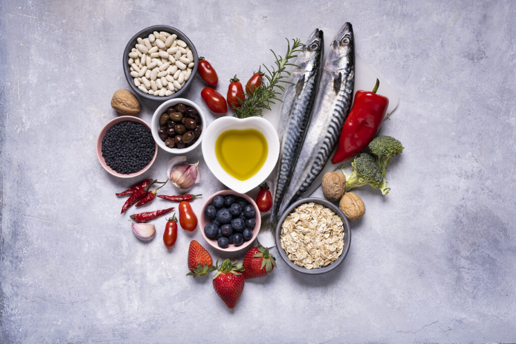 variety of Mediterranean healthy foods based on legumes, fish, vegetables, fruits and grains